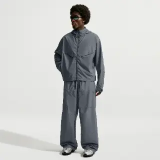 Nike Tech ruimvallende herenbroek met reflecterend design - Blauw