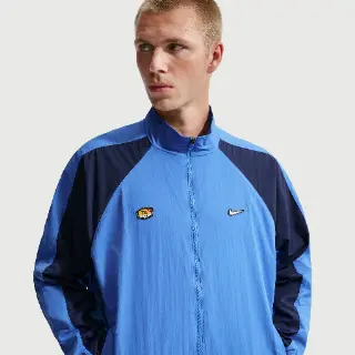 Nike Tuned geweven trainingstop voor heren - Blauw