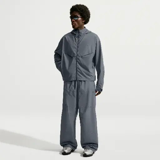 Nike Tech ruimvallende herenbroek met reflecterend design - Blauw